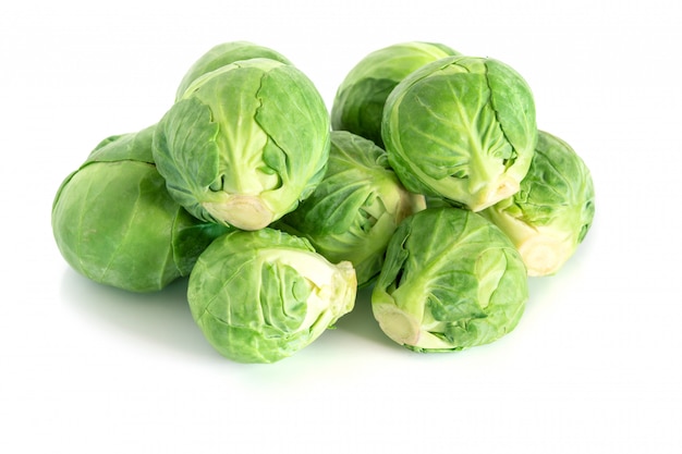 Premium Photo The Fresh Green Brussel Sprouts Vegetable On White Surface 