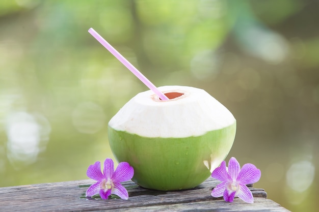 Download Premium Photo Fresh Green Coconuts With Drinking Straw