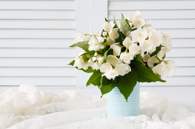 Premium Photo Fresh Jasmine Flowers In A Vase On Wooden