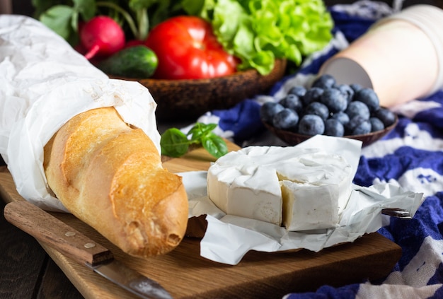 Fresh juices, various vegetables and berries, baguette and cheese ...