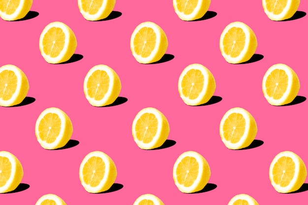 Premium Photo | Fresh lemon (lemons) pattern on pink background