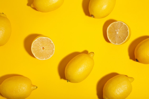 Premium Photo | Fresh lemon on yellow background. tropical fruit.