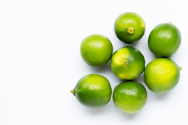 Premium Photo | Fresh limes isolated on white.