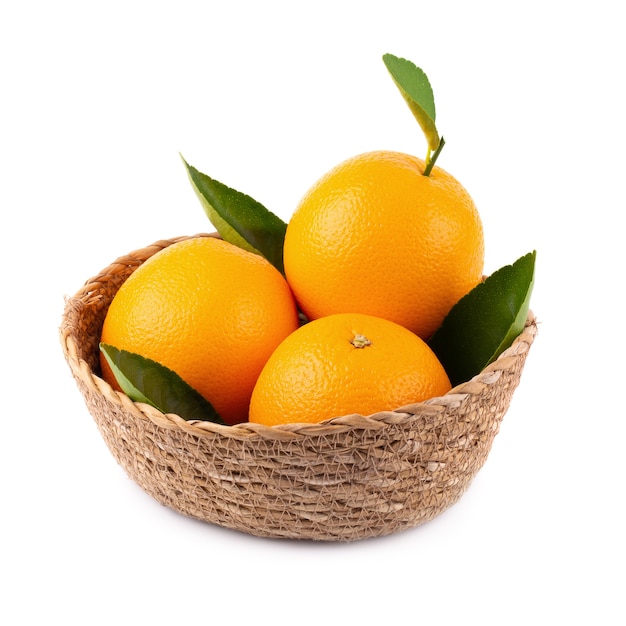Premium Photo | Fresh orange in the basket isolated on a white background