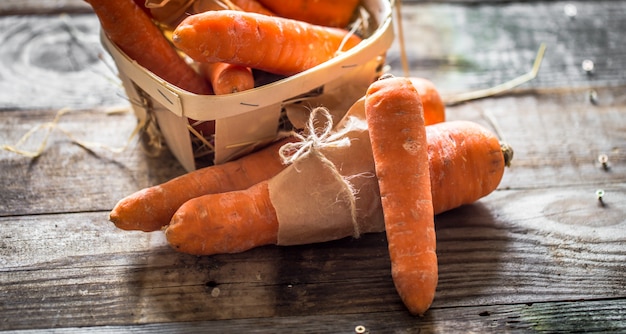 Free Photo | Fresh organic carrots, a bunch of carrots lying on wooden ...