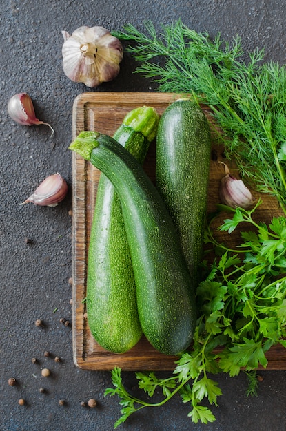 Premium Photo | Fresh organic zucchini, garlic and parsley, herbs and ...