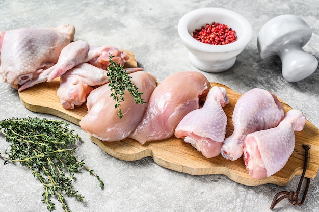 Premium Photo | Fresh raw chicken meat parts assortment