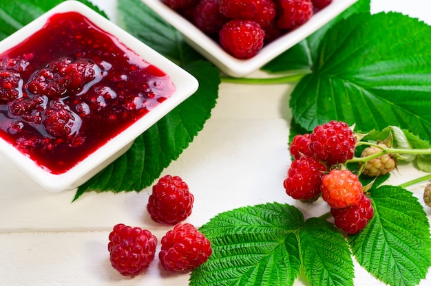Fresh ripe red raspberry and raspberry jam Premium Photo