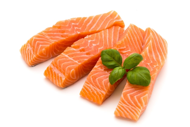 Premium Photo | Fresh salmon fillet with basil on the white background.