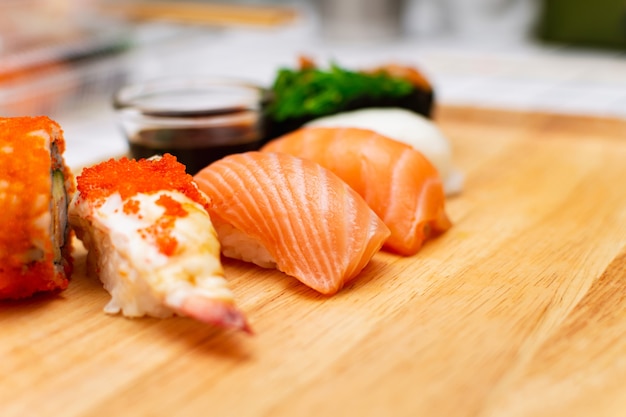 Premium Photo | Fresh salmon sushi with shrimp and tobiko (flying fish ...