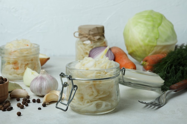 Premium Photo | Fresh sauerkraut and ingredients on white textured table