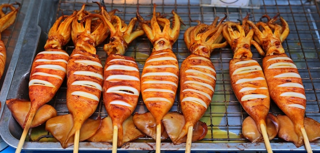 Premium Photo | Fresh squid barbecue grilled, street food in bangkok ...