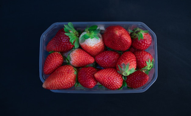 Download Premium Photo Fresh Strawberries In A Plastic Bowl