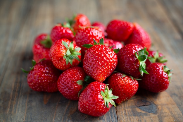 Free Photo | Fresh strawberries on wooden table.