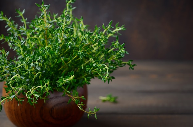 Sage Substitutes -Fresh thyme on wooden pot 