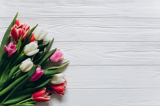Premium Photo | Fresh tulips on a white wooden background. mothers day ...