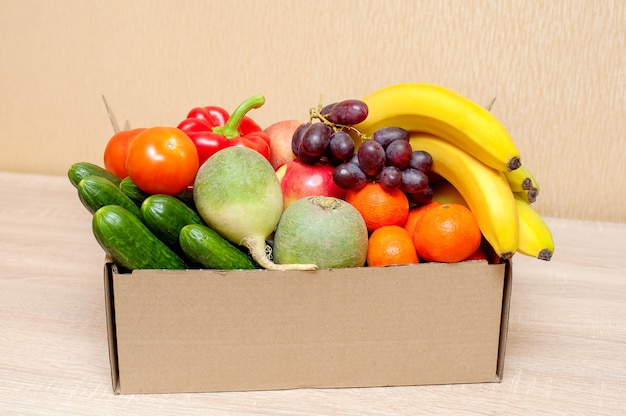 Premium Photo Fresh Vegetables And Fruits In A Cardboard Box On A