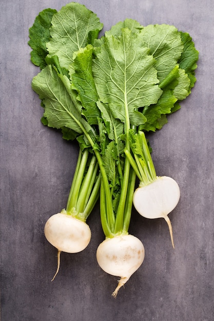 Premium Photo | Fresh white round turnip radish on white surface.