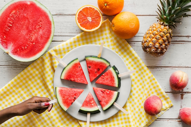 Freshly slice watermelon on sticks Photo | Free Download