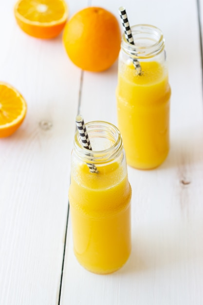 Freshly squeezed orange  juice  on a white background 