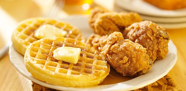 Premium Photo | Fried chicken and waffles on a plate