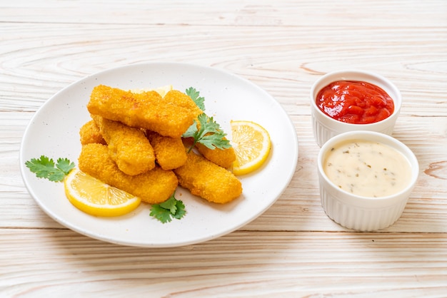 premium-photo-fried-fish-fingers-with-sauces