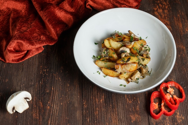 Premium Photo Fried Potatoes With Mushrooms And Onions