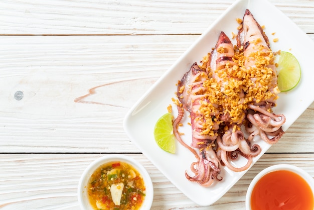 Premium Photo | Fried squid with garlic