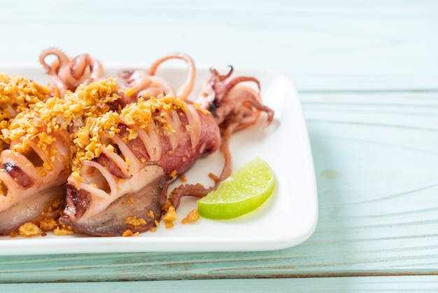 Premium Photo | Fried squid with garlic