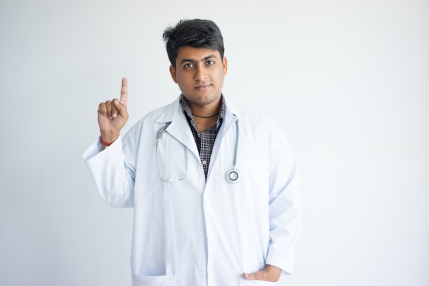 Free Photo | Friendly young doctor giving patient advice or suggestion.