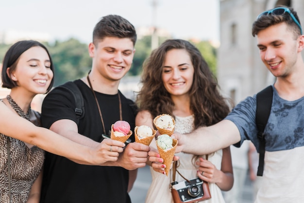 Friends cheering with ice cream Free Photo