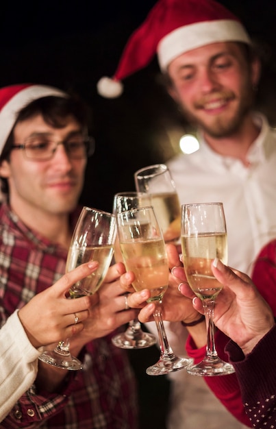 Free Photo Friends Clinking Champagne Glasses Toasting Christmas