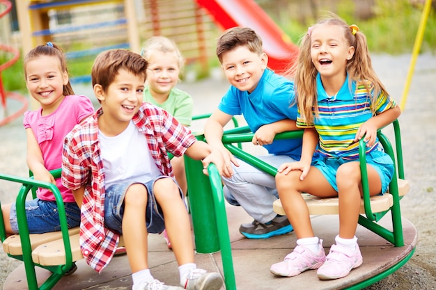 Friends laughing in the playground Photo | Free Download