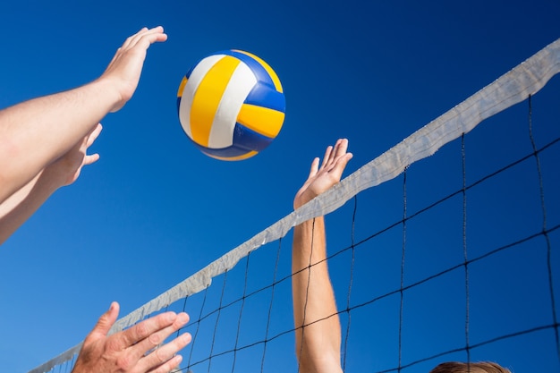 Premium Photo | Friends playing volleyball