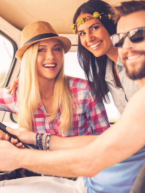 Premium Photo Friends On Road Trip Three Cheerful Young People Looking At Camera And Smiling 3876