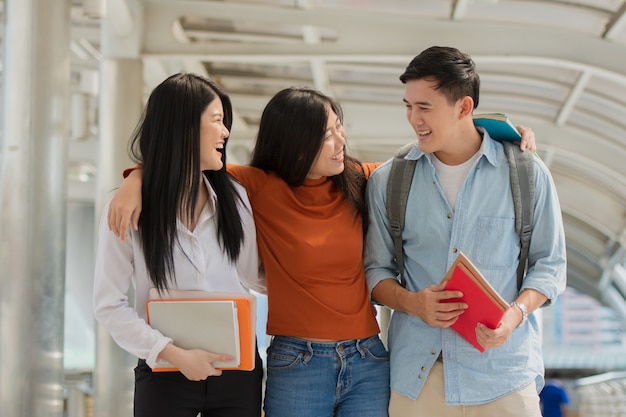 Premium Photo | Friendship in campus, college students with books spend ...