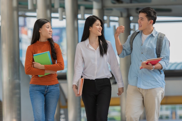 Premium Photo | Friendship in campus, college students with books spend ...