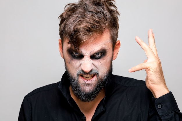 Premium Photo | The frightening look of a bearded man with undead-style ...