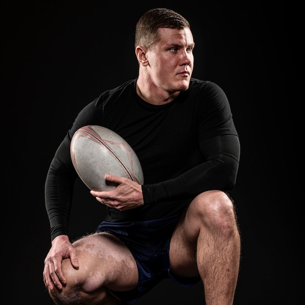 Free Photo | Front View Of Athletic Handsome Rugby Player Holding Ball ...