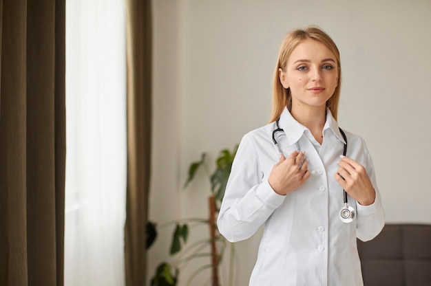 Front view of covid recovery center female doctor with stethoscope Free Photo