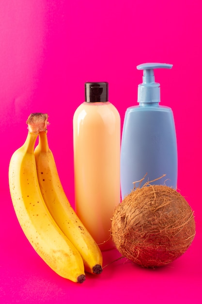 Download A front view cream colored bottle plastic shampoo can with black cap isolated along with bananas ...