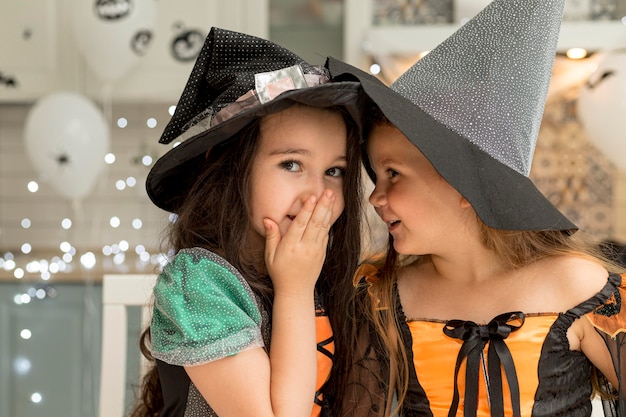 Free Photo Front View Of Cute Little Girls With Witch Costume