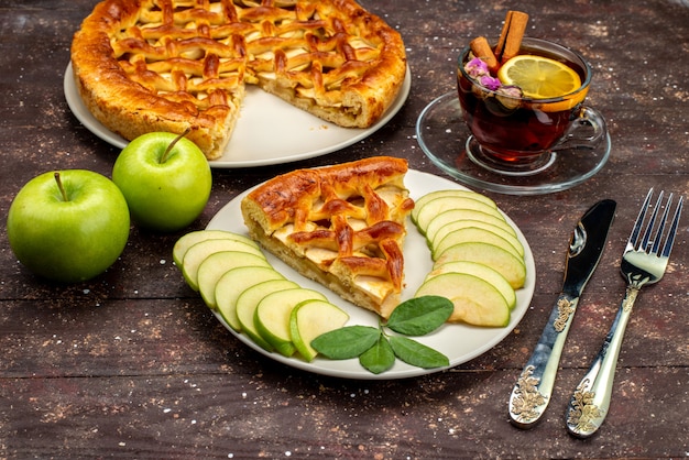 Free Photo | A front view delicious apple cake with tea fresh green ...