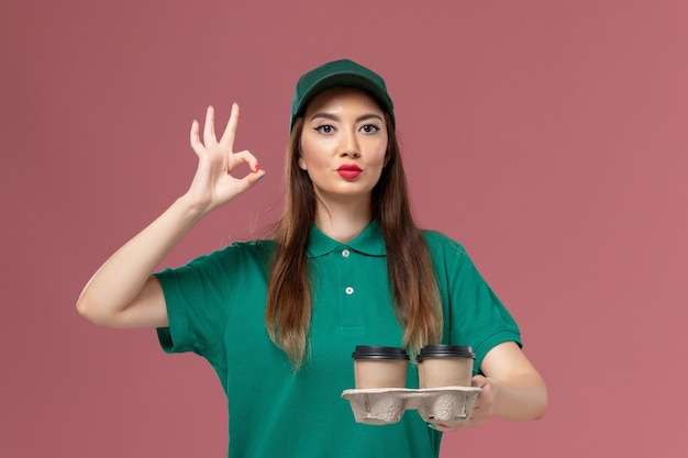 Free Photo | Front view female courier in green uniform ...