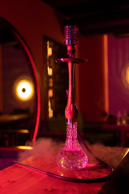 Free Photo | Front view full shot of hookah in cafe light