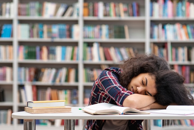 Free Photo Front View Girl Fell Asleep At Library While Studying