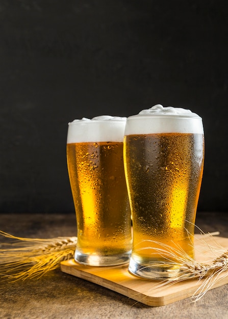 Free Photo Front View Of Glasses Of Beer With Wheat