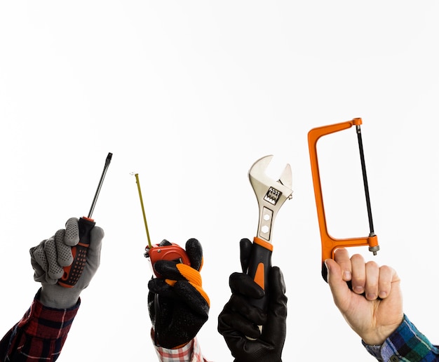 Premium Photo | Front view of hands holding tools with copy space