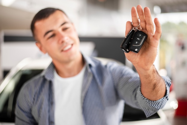 Premium Photo | Front view happy man holding car keys