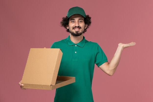 Download Free Photo | Front view male courier in green uniform and ...